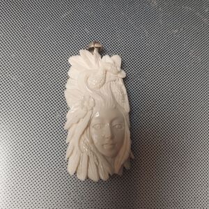 Bali handcrafted wood nyphm of bone.one of a kind pendant